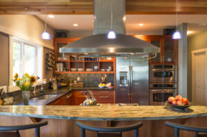 Renovated kitchen with stainless steel oven hood