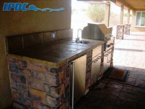 Outdoor kitchen with brick accents