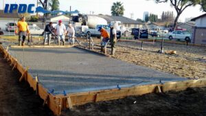 Construction workers laying out foundation