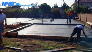 Construction workers laying out foundation