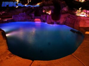 Outdoor night time swimming pool with lights